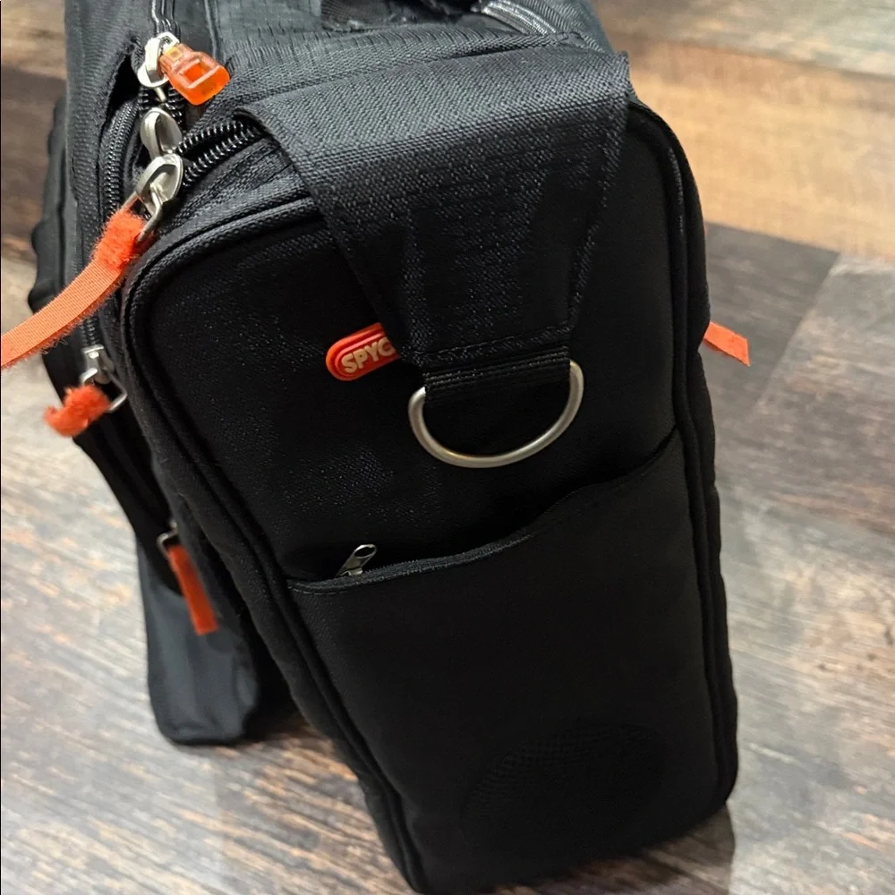 Stylish Spy Optic Inc. Black and Orange Bag/Backpack.